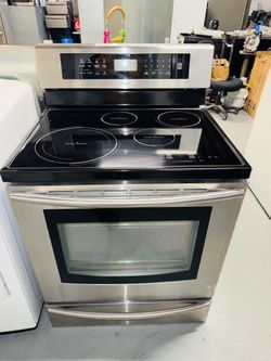 Samsung electric induction range, stainless steel finish; includes a receipt for a 90-day warranty.
