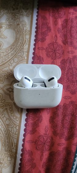 AirPods Pro charging case with both white wireless earbuds