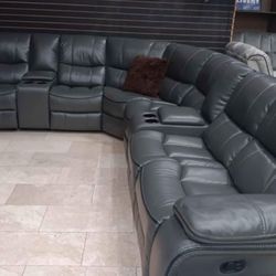 Spring Blowout Sale! Madrid, Leather Reclining Sectional In Gray Or Black Only $1099. Easy Finance Option. Same-Day Delivery.