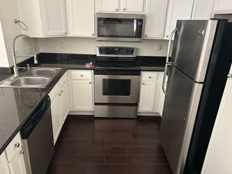 GE Stainless Steel Built-In Dishwasher / whirl pool oven and microwave / Frigidaire refrigerator