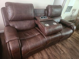 2 automatic recliners with power outlets.