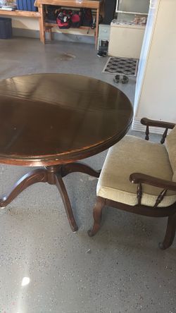 Round table with upholstered chairs