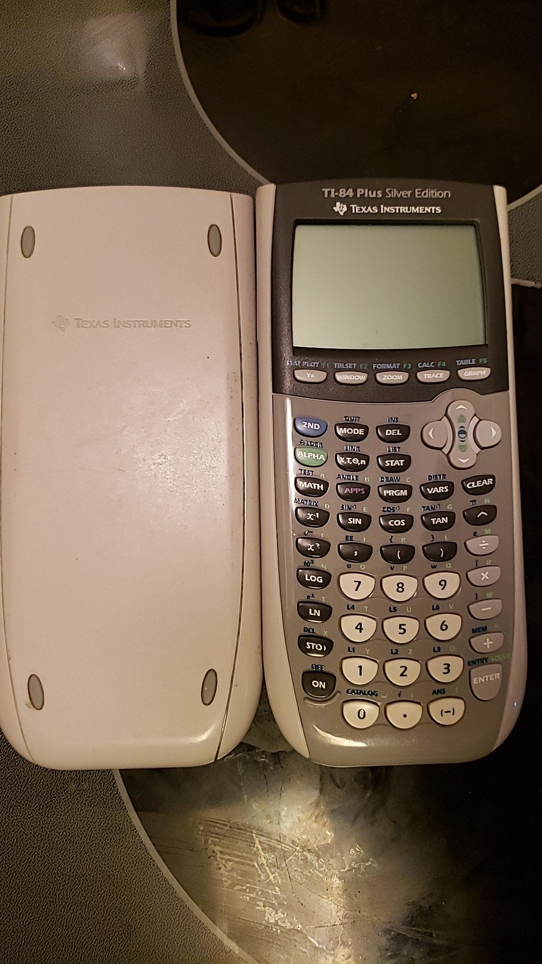 TI 84 Plus Silver Edition graphing Calculator & a TI 30x IIS scientific calculator