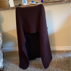 Purple Scarf That Is  Extremely Long And Wide. It’s A Beautiful Part Of A Fashion Statement Or You Can Just Use It To Keep Yourself Warm.