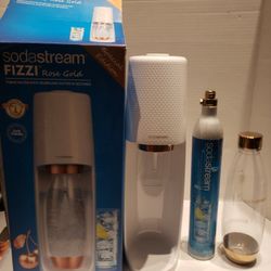 SodaStream rose gold edition with a gold 1 liter bottle barely used like new and 1 Canister selling for only $60