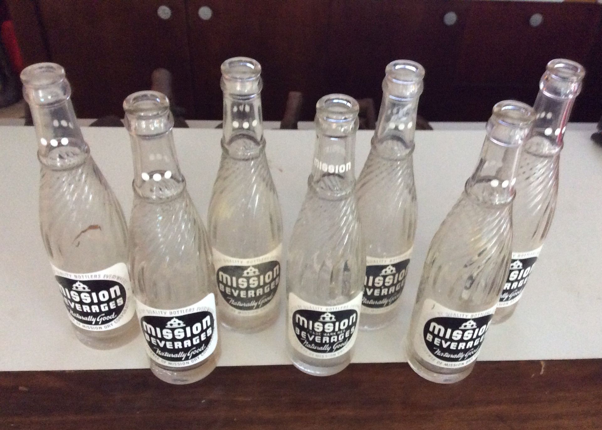 Set of 7 Mission Beverages Antique Bottles