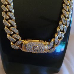 A diamond necklace with the letter C