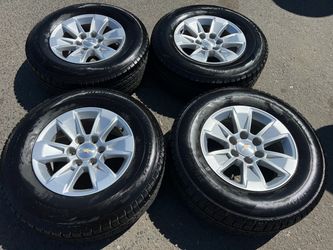 17” stock Chevy gmc rims and tires for sale 75% tread 6 lug
