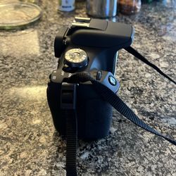 Canon Rebel T7 w/ 18-55mm lense