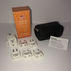 NIB Brookstone travel adapter set and case