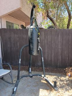 Punching bag with stand and extras.