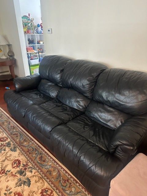 Two Black Leather Sofas