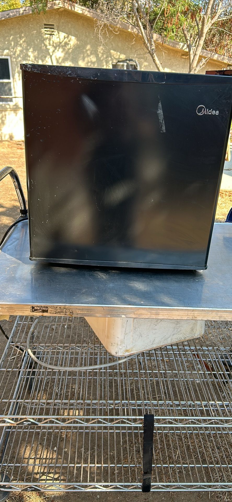 Mini Refrigerator ( This Is The Short On Sitting On A Table