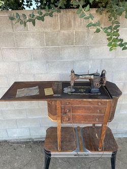 White Rotary sewing machine housed in a distinctive curved-front Martha Washington-style wooden cabinet, popular during the 1910s to 1920s ❗️Cabinet i