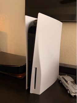 PlayStation 5 Disc version with controllers and games