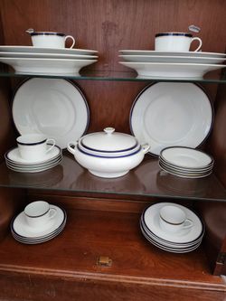 White Porcelain Dinnerware Set with Blue and Gold Trim