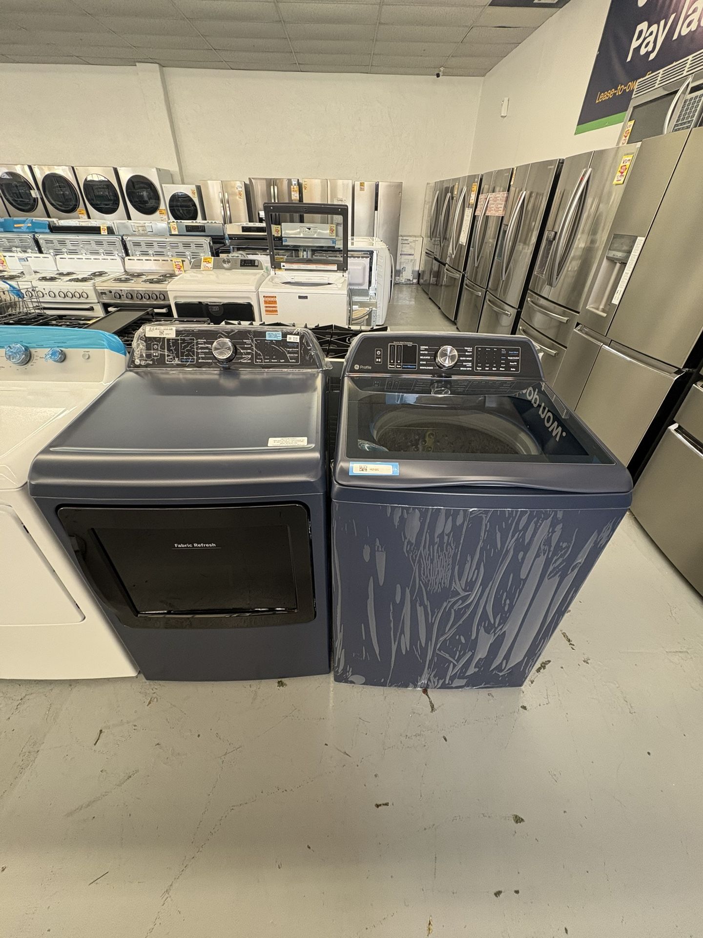 GE Profile 5.3 cu. ft. Capacity Top Load Washer with Smarter Wash Technology and Adaptive SmartDispense Profile 7.3 cu. ft. Smart Gas Dryer