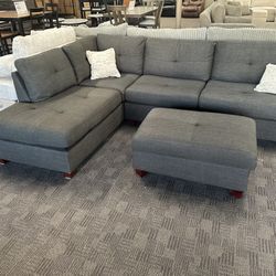 Charcoal Black Sectional And Ottoman 