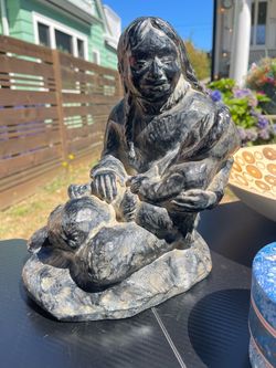 Eskimo lady & child- sculpture Aprox 12”x 9”