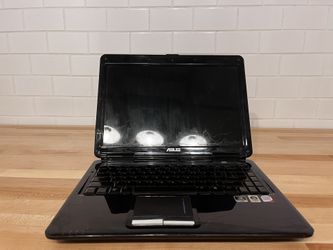 Asus Laptop, Charger and Case to carry it