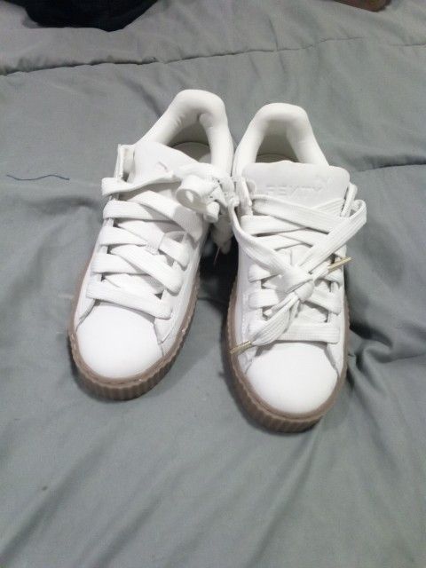 Size 9 1/2 Womans Pumas