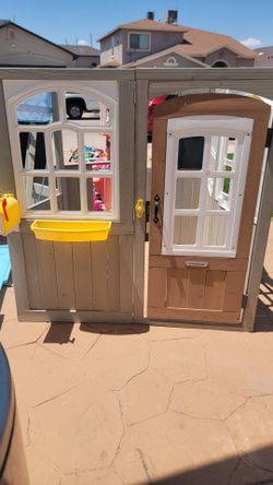 Kidskraft wooden playhouse.