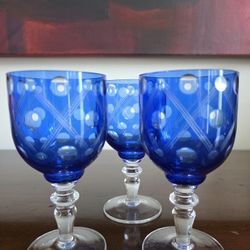 Set of three cobalt blue flashed cut-to-clear wine glasses.