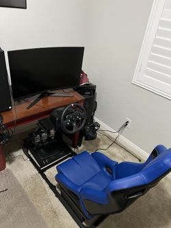 Full Logitech racing sim and 32in curved monitor