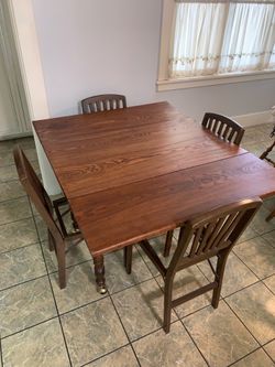 Oak table and non-matching chairs