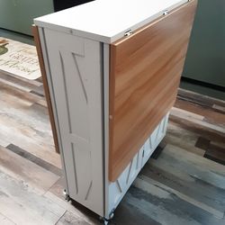 ****  FREE. Adjustable table with fold down leaf. ****