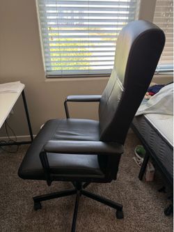 Leather office chair with high back rest