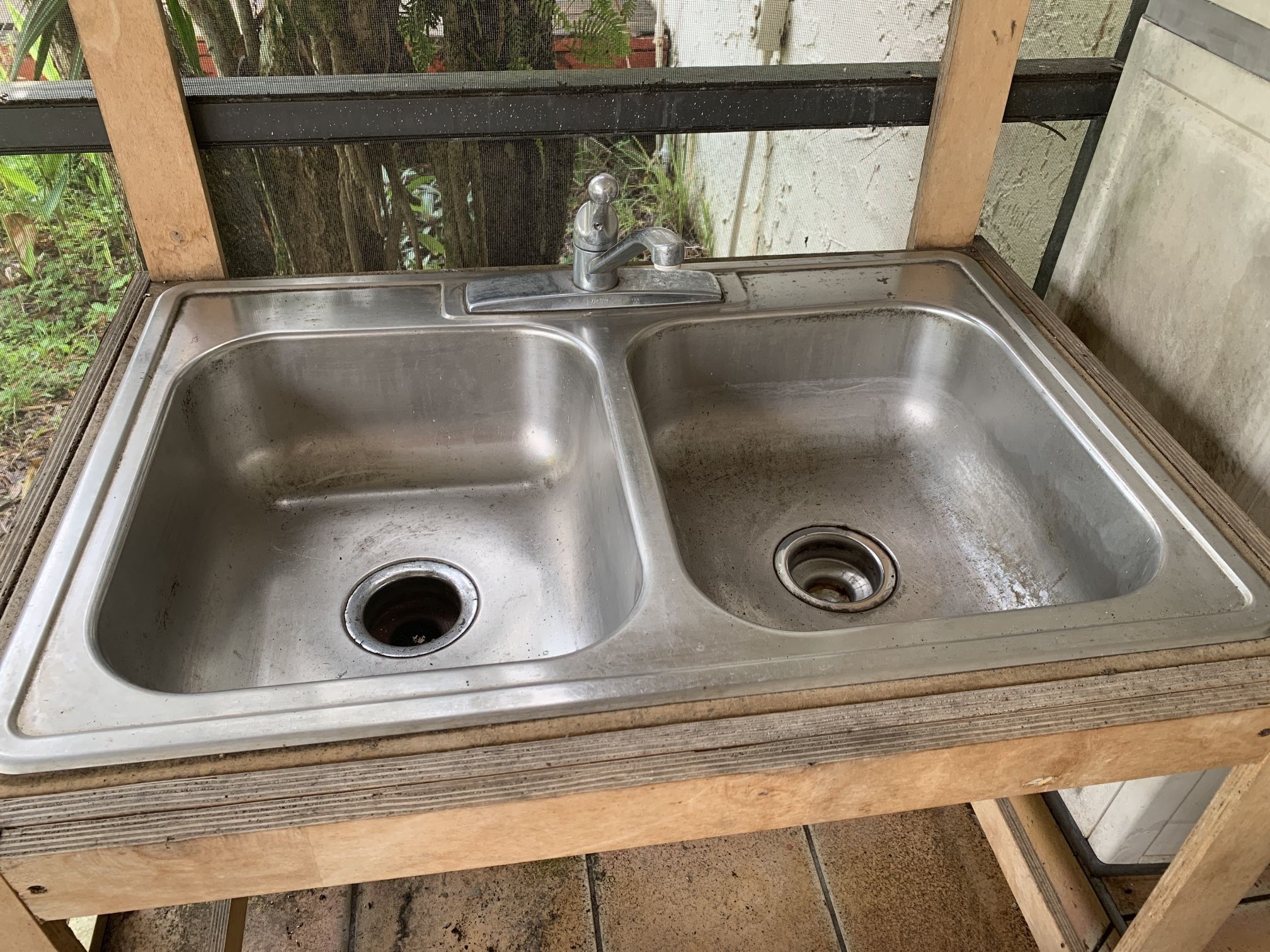 Stainless steel sink with faucet. 22” x 33” (negotiable)
