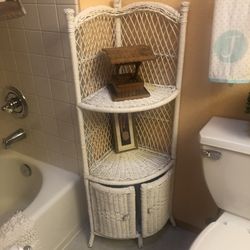 Wicker corner plant storage cabinet