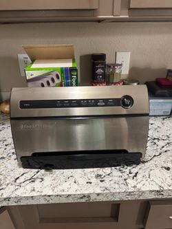 Food saver with box of rolls and bags