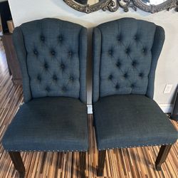 Two dark blue, elegant chairs
