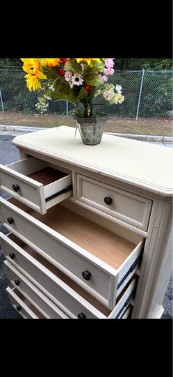 Solid wood tall chest with top jewelry .