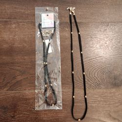 2 black-and-gold Magic Chain multi-use lanyard designed to hold a mask, glasses, or ID badge,