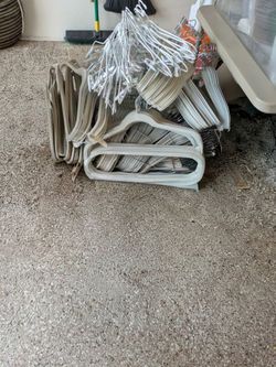 25 hangers bundle. Assortment of different types of hangers. Ones with clips for pants or skirts, felt ones so the clothes don't slip off the hanger