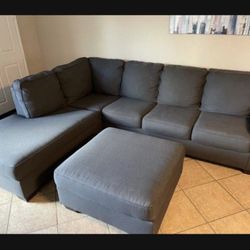 Beautiful Charcoal grey sectional with matching ottoman
