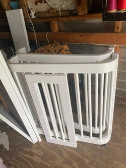 White baby crib converts into a toddler bed