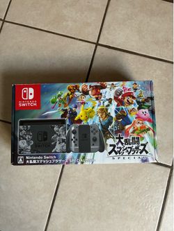 Nintendo Switch super smash bros edition with 512 memory card, satisfye grip and case