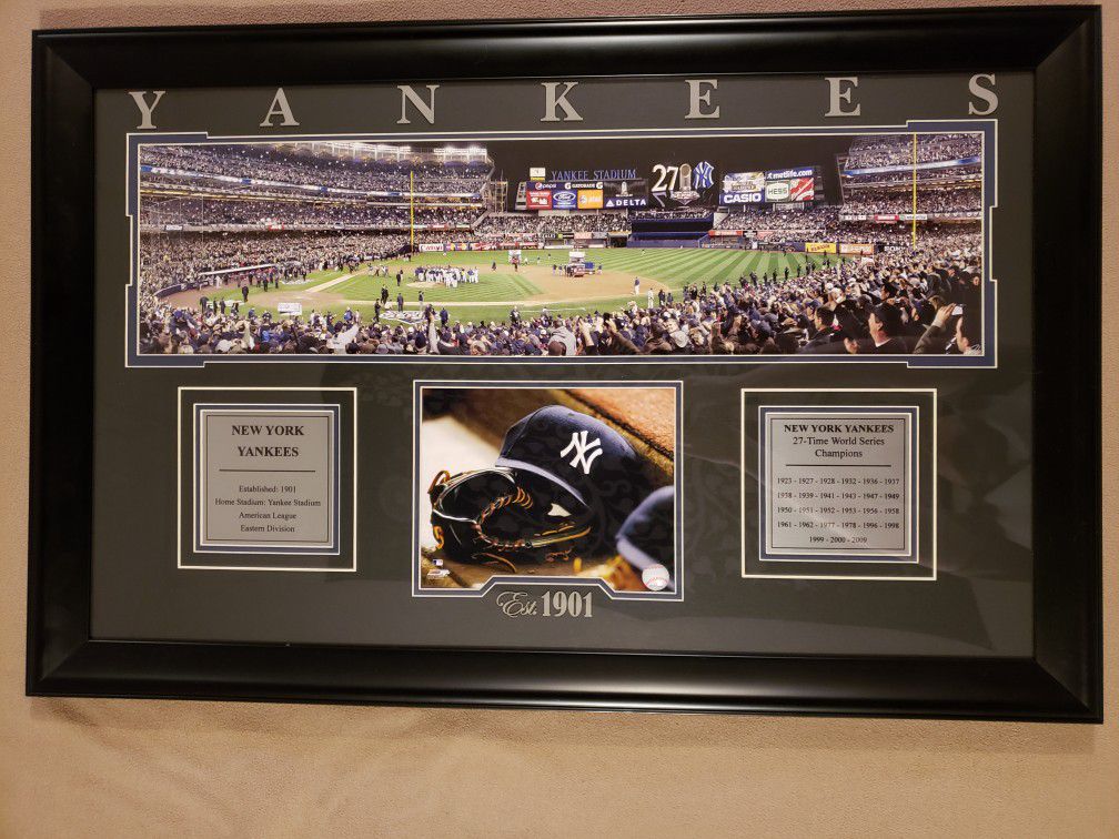 Framed picture of Yankees celebrating after winning 27th World Series