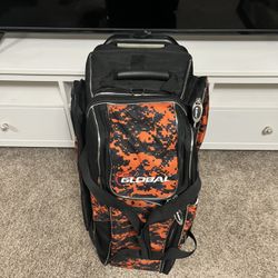 900 Global Deluxe 3 Ball Roller bowling bag in an orange and black digital camouflage pattern. 