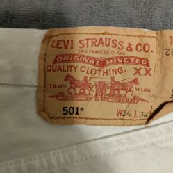 White Levi Red Tags, 34W, 32"L. Rivets.