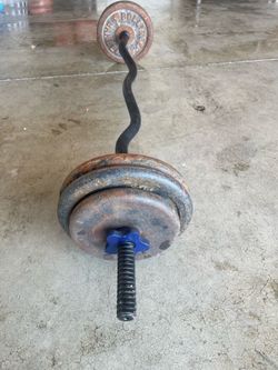 Curl bar and 55 pounds on plates