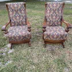 Antique Victorian Eastlake platform rocking chairs with carved walnut frames 