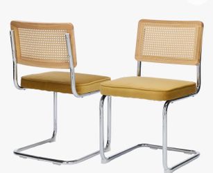 Yellow cantilever dining  chairs.  Brand new in box.