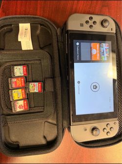 NINTENDO SWITCH V2 WITH GAMES AND CASE