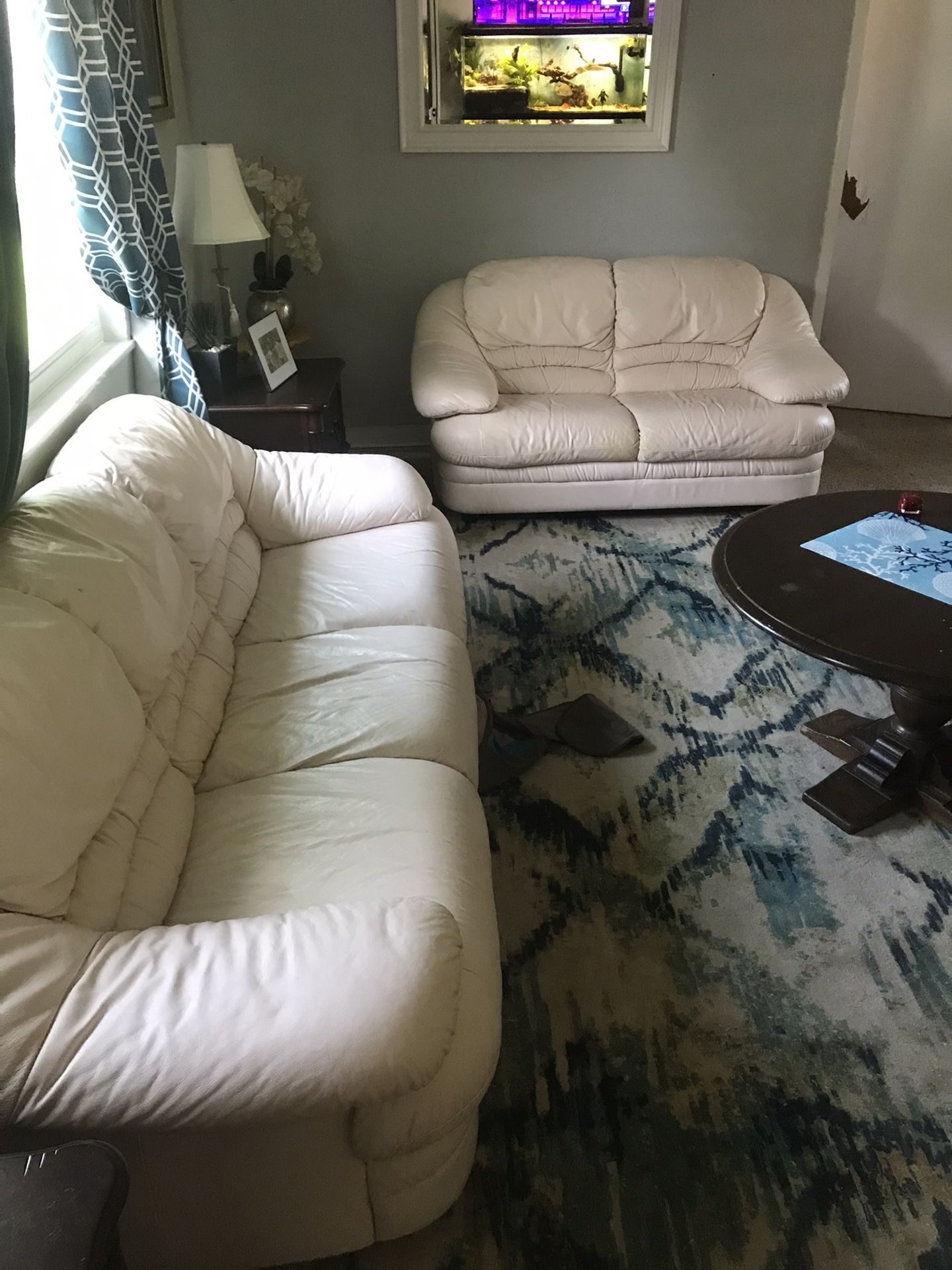 White leather couch and love seat
