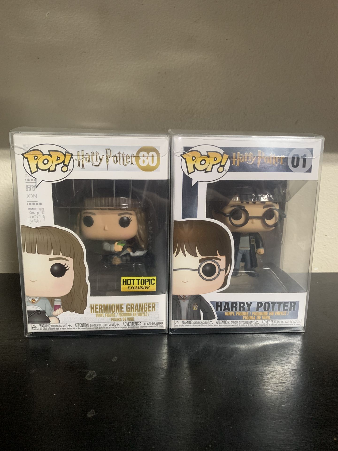 Hermione Granger And Harry Potter Funko Pops With Protective Cases